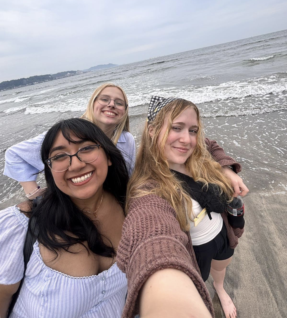 Ashley and two friends at the beach.