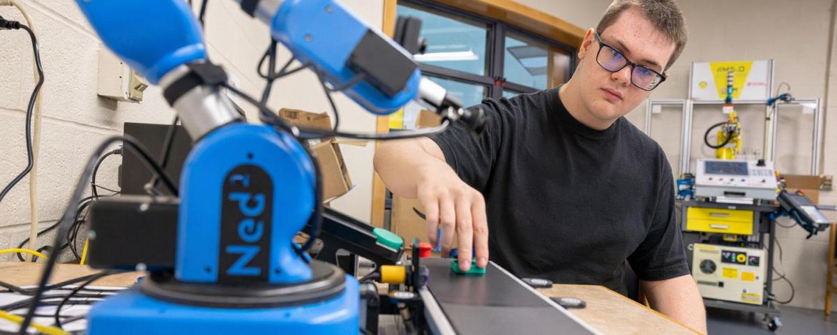 Electrical technology student in robotics lab