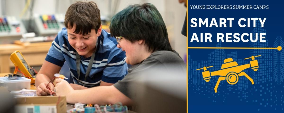 Young Explorers Camp: Smarty City Air Rescue with a photo of two youth working on an engineering project.