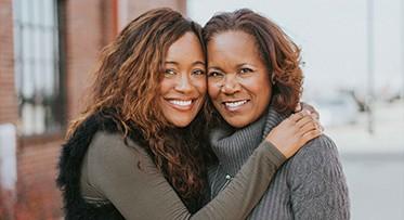 Mother Kerry Schrader and daughter Ashlee Ammon pose for a photo together