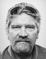 Bob Christy, Kent State’s senior photography coordinator, has his portrait taken by a fellow university photographer. (Photo by Rami Daud)