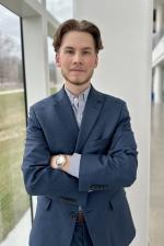 Felipe power pose shot in Crawford Hall