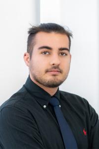 Gage McCreary staring at camera headshot