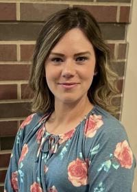 Woman in flowered shirt