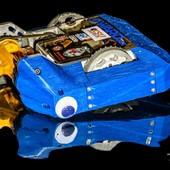 Closeup photo of a blue combat robot's drive motor.
