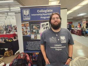 Dylan Cochran at the Route Eight Studio table at Akron ComicCon
