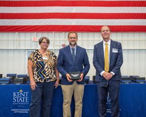 Past Dean Christina Bloebaum, Dean's Wings award recipient Dave Poluga, and Interim Dean John Sankovic.