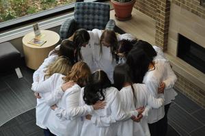 The BSN sophomore class huddle up to show support for each other.