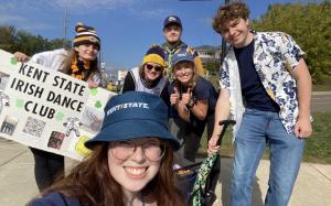 Rebecca LaGuardia posing for a photo with a group from the Irish Dance Club. 