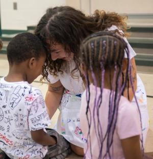 Molly Schillace with young students