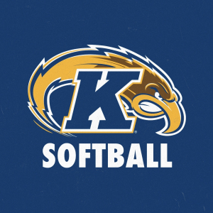 A blue letter "K" overalid on a bird's head in profile over the word "SOFTBALL"