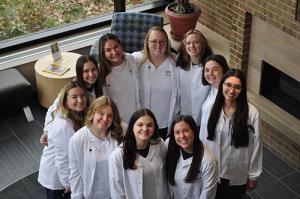 Class of 2028 with their new white coats