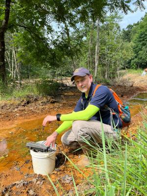 David Singer collects soil samples
