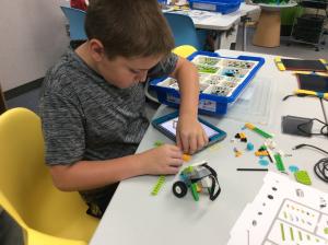 Boy building robot