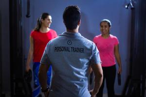 Picture of a personal trainer with two clients