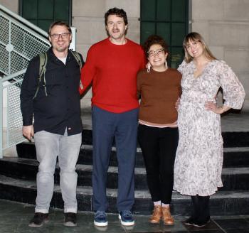 Poets Charlie Malone, Ben Kline, Felicia Zamora, and Sara Moore Wagner, pose for a photo on the stairs of the ����ԭ�� Fashion museum