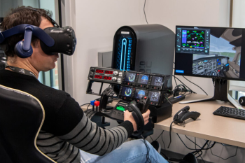 A student uses extended reality in a flight simulation