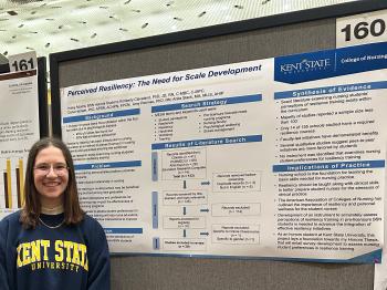 BSN student Haley Adams stands next to her poster at the March 2025 MNRS conference.