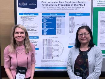 Drs. Petrinec and Wang with their poster