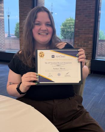 Sydney Moon with award winning certificate