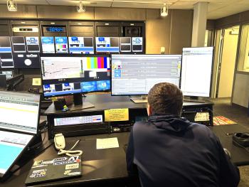 student media student works on computer inside the tv studio