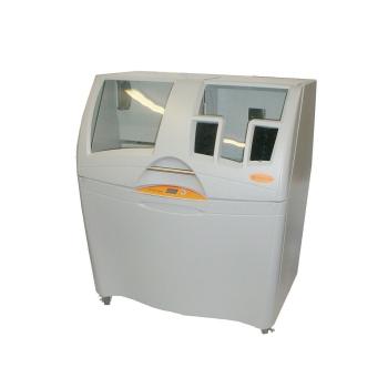 A large 3D printer in a gray cabinet with two see-through clear plastic windows