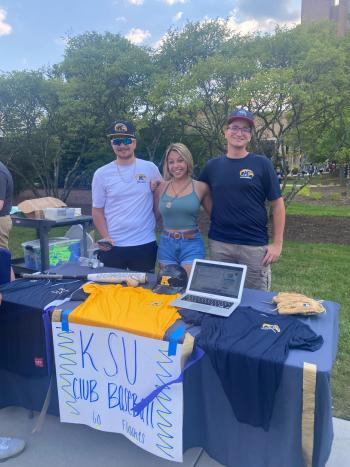 Amaya posing with friends at a club fair