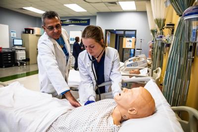 Kent State Twinsburg nursing students and instructor using a patient simulator