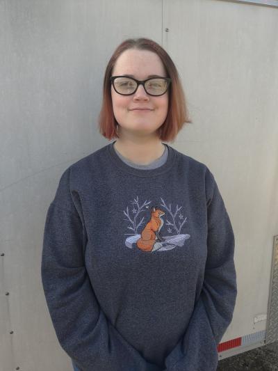 Alex Bathrick in a gray sweatshirt