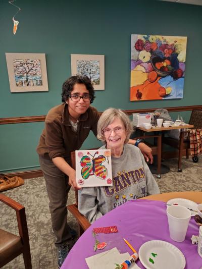 Manacy (Mansi) Pai (left) with a resident at Danbury Senior Living in North Canton 