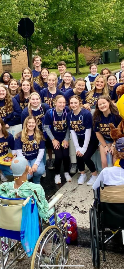 Halle in a group of nursing students, all wearing shirts that say "Nursing Saves Lives."