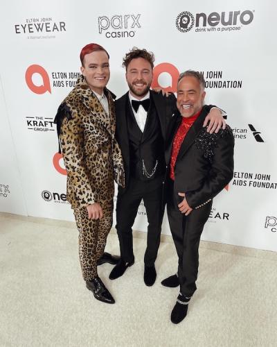 Tyler Piña posing with two others at celebration gala