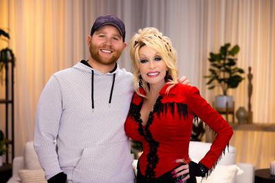 KSU alumnus Bryan Webb posing for a picture with superstar Dolly Parton