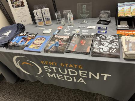 A student media information table displaying copies of all the recent magazines