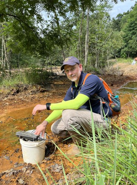 David Singer, Ph.D., collecting and analyzing acid mine drainage sediments in Irondale, Ohio. 