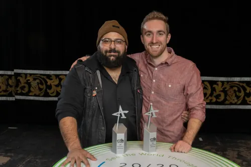 Rami Daud and Nathaniel Bailey, photographers with University Communications and Marketing, smile after receiving their Silver ADDY Awards. (Photo credit: Smithberger Photography)
