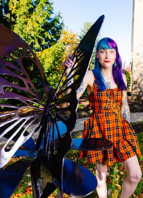 Butterfly sculpture with artist