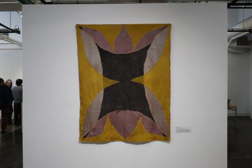 Textiles piece featuring green, pink and yellow colors