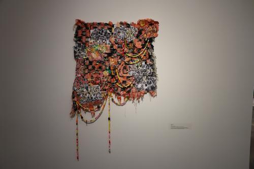 Textiles piece featuring mixed media elements and found objects