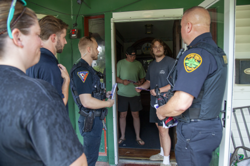 Kent Police, Kent State University Police and university Student Legal Services representatives visit off-campus students.