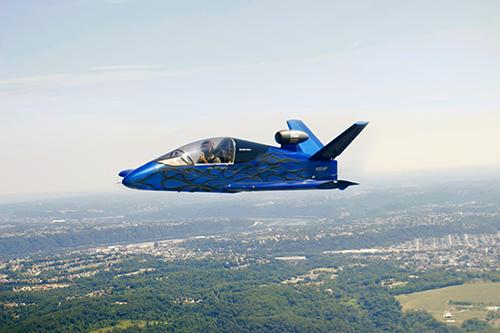 A blue JSX-2 aircraft in flight