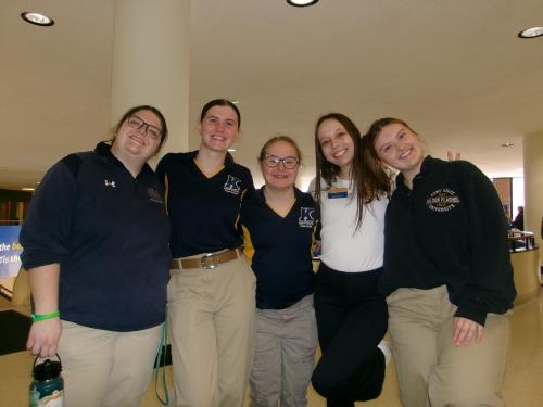 Kellyn (center) poses with fellow Tour Guides at an on-campus event in the Student Center.