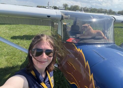 Lucy poses for a selfie with the plane Flying Deuce.