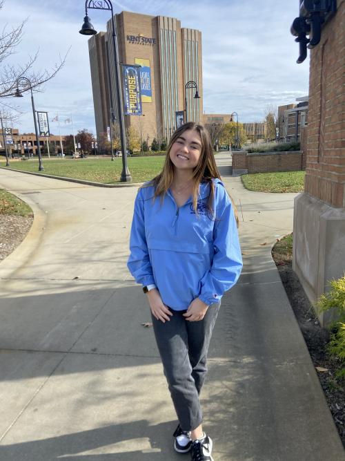 Mia standing outside the library