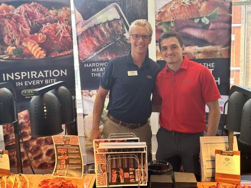 David Rankin (right) at a table with his Mentor, Austin