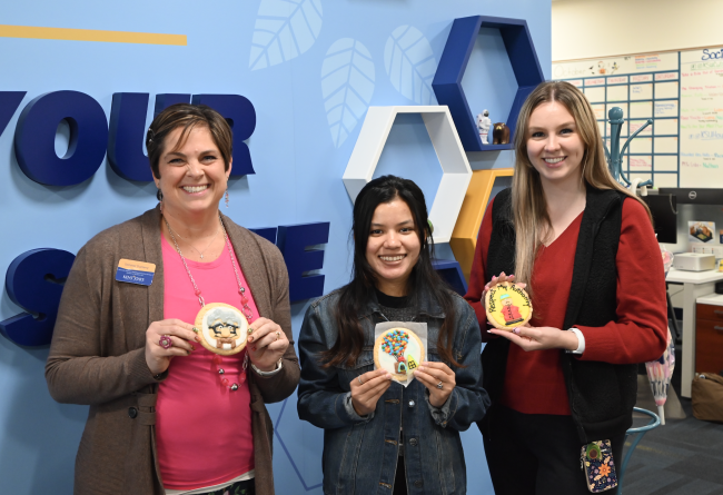 staff and students enjoying cookies