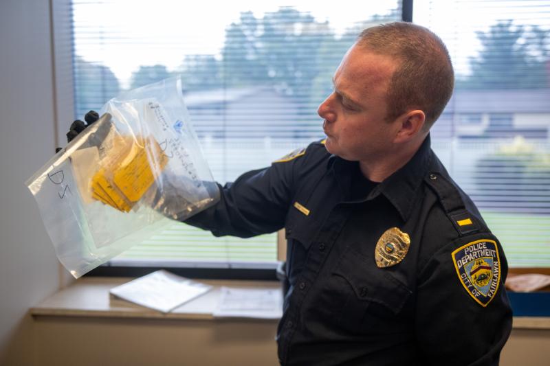 A Fairlawn Police Detective Holds Evidence in the Cold Case Murder of Fred Hale