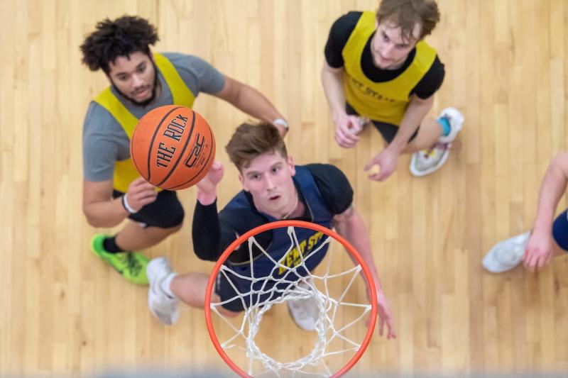 students playing basketball at the rec center