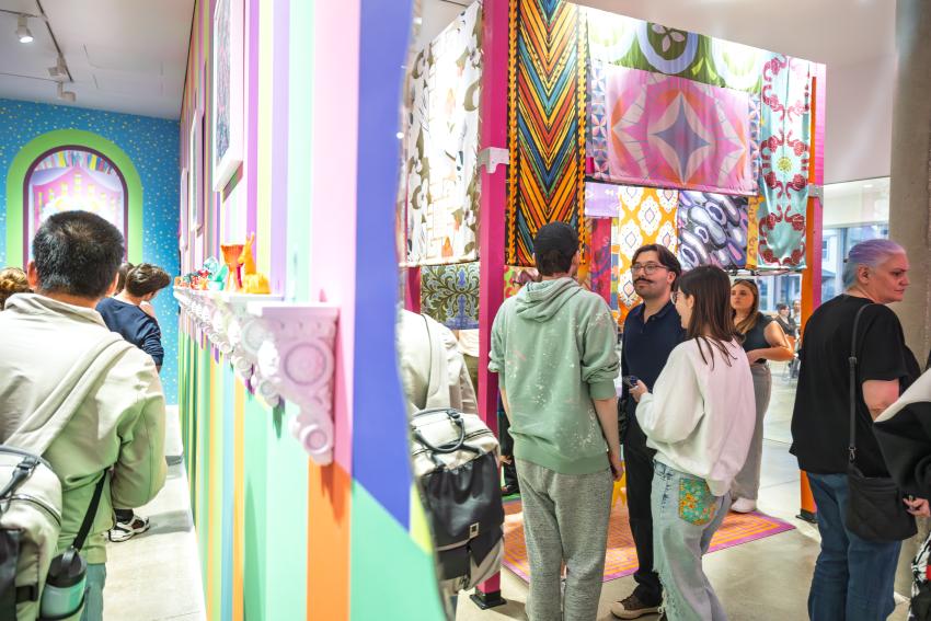 Students and faculty viewing the gateway in the Armstrong Gallery