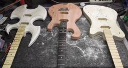 Three very different guitars created by �Ը������� student Ryan Schoeneman’s business are seen in the process of being assembled.